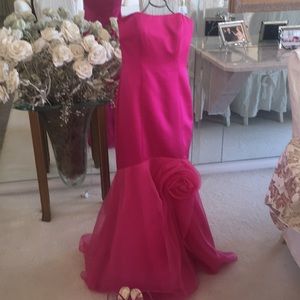 Magenta mermaid gown perfect for prom or wedding.
